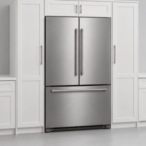 Stainless built-in refrigerator installed flush with white shaker cabinets