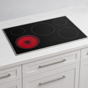Stove Repair 100 Black glass electric cooktop set into a white quartz countertop
